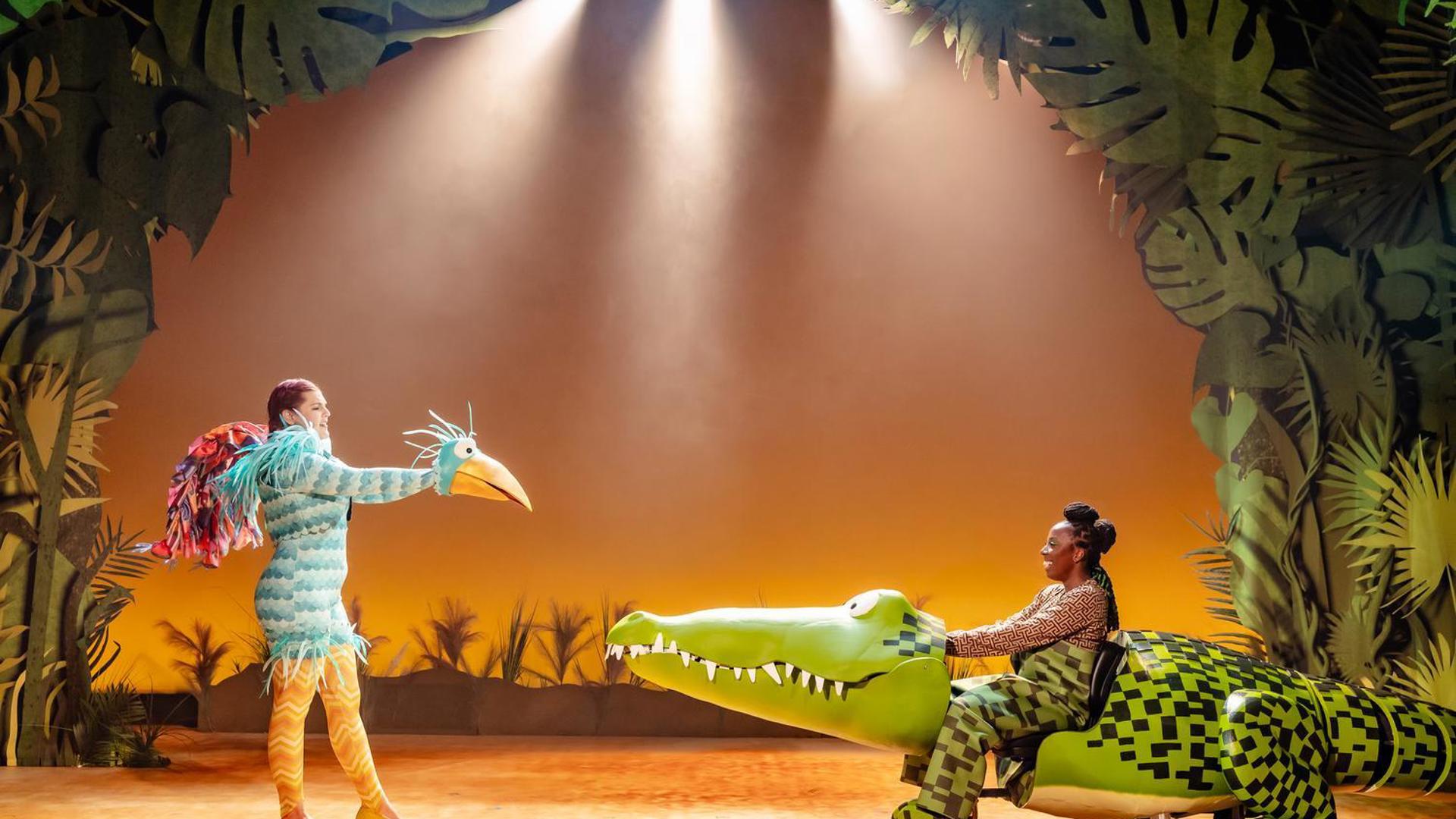 A large blue bird talks to The Enormous Crocodile.