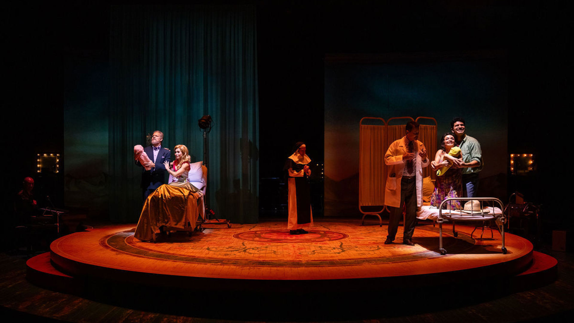Two couples welcome a child with a nun standing in the center of the stage. 